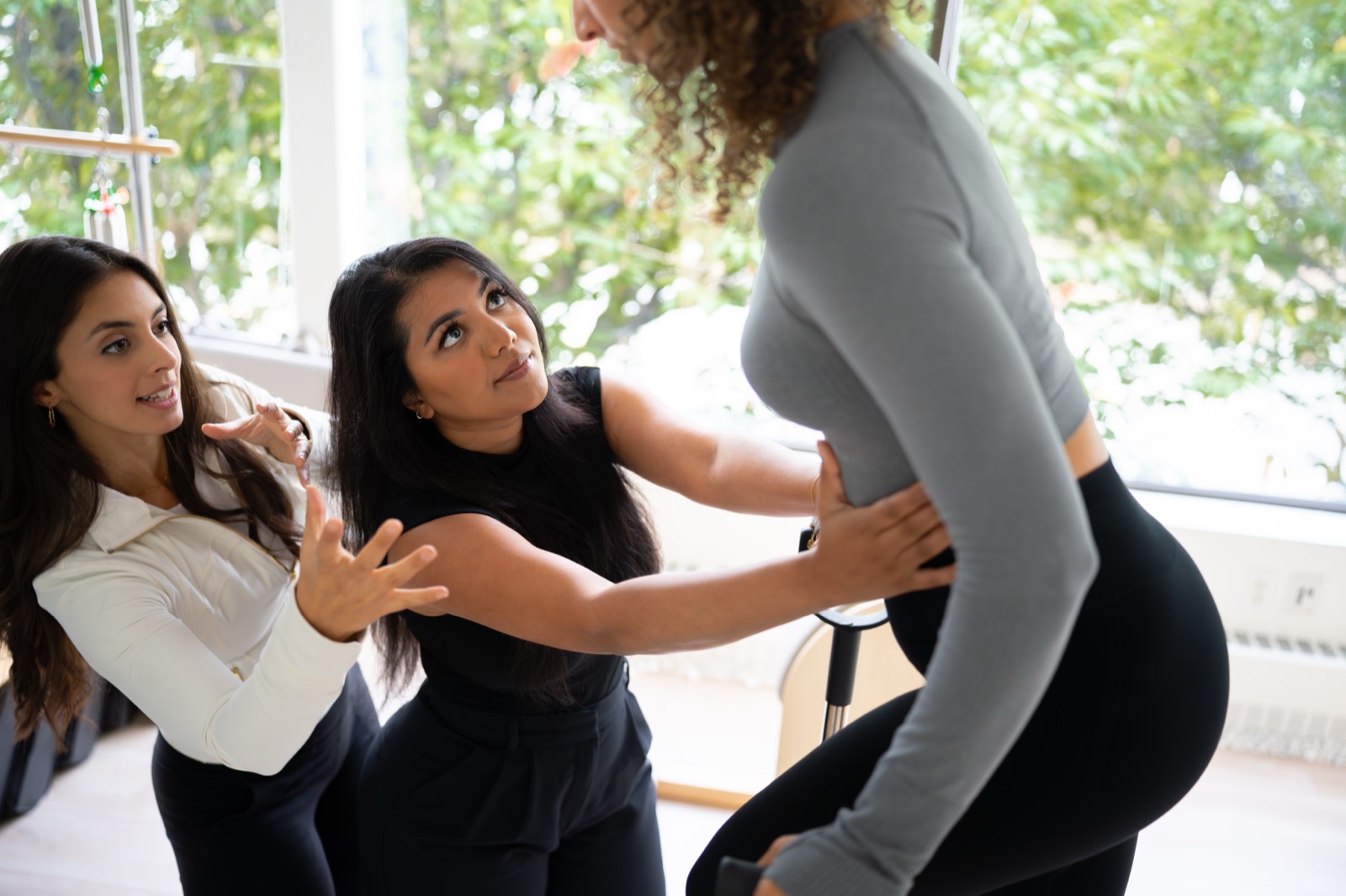 A physiotherapist carrying out a hands-on core and pelvic assessment
